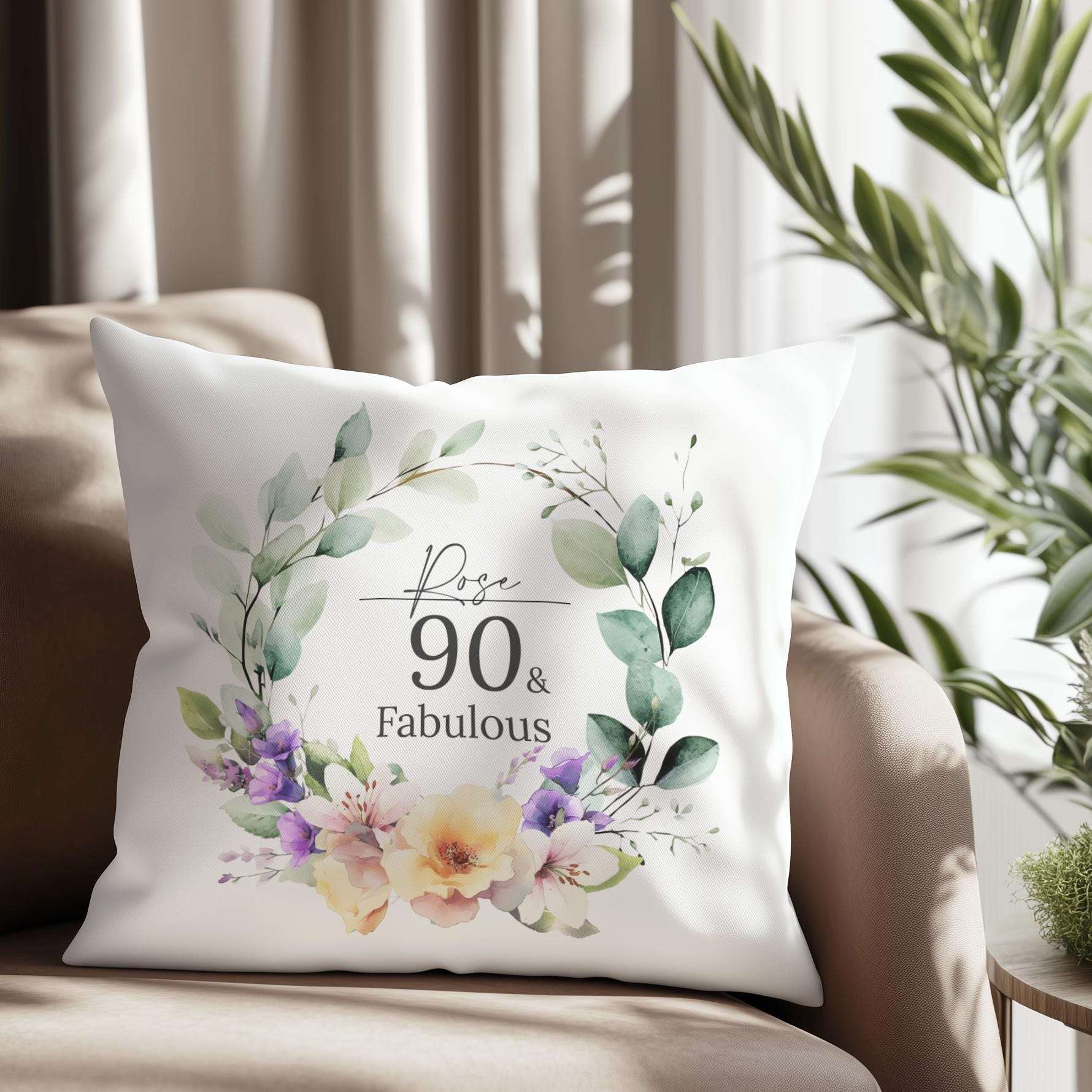 Personalised 90th birthday cushion with an elegant watercolour birth month flower design, roses, and lilies