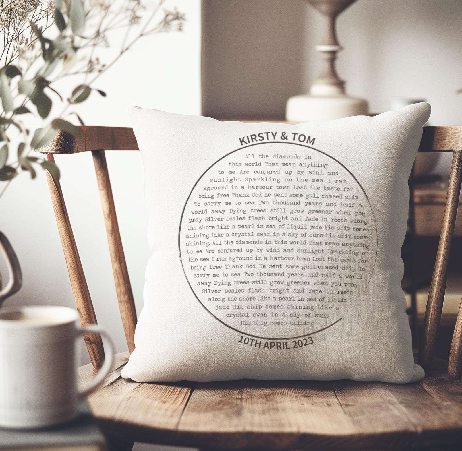 Personalised cushion featuring custom song lyrics in a spiral vinyl record design, with couple's names and date