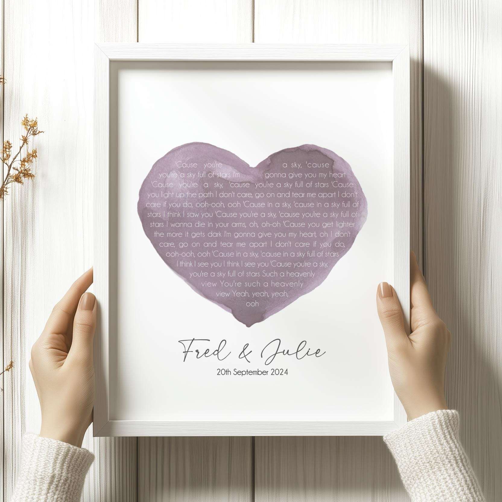 Personalised print featuring song lyrics inside a watercolour heart, customised with names and a wedding or anniversary date