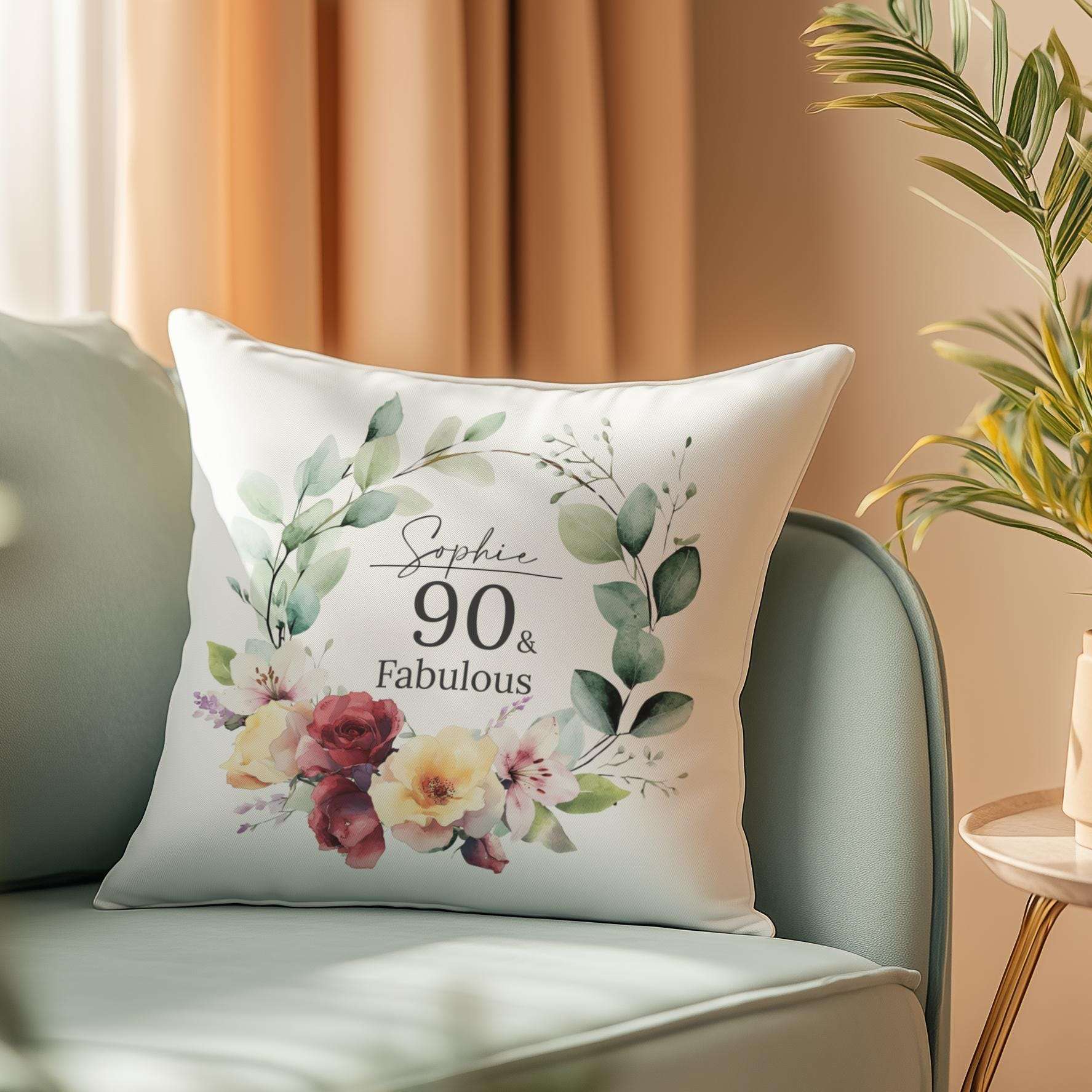 Personalised 90th birthday cushion with an elegant watercolour birth month flower design, roses, and lilies