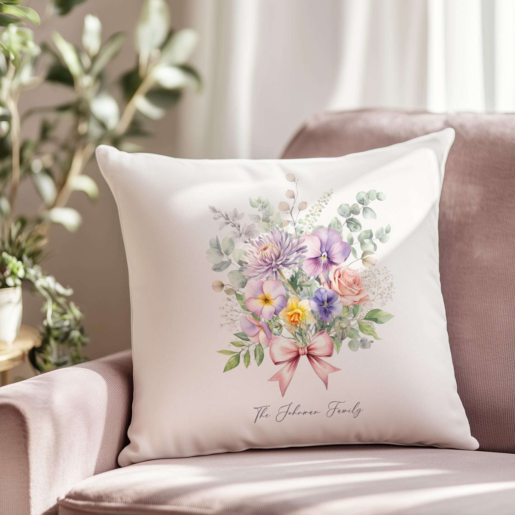 Personalised family cushion featuring a delicate bouquet of birth month flowers with custom names and family surname