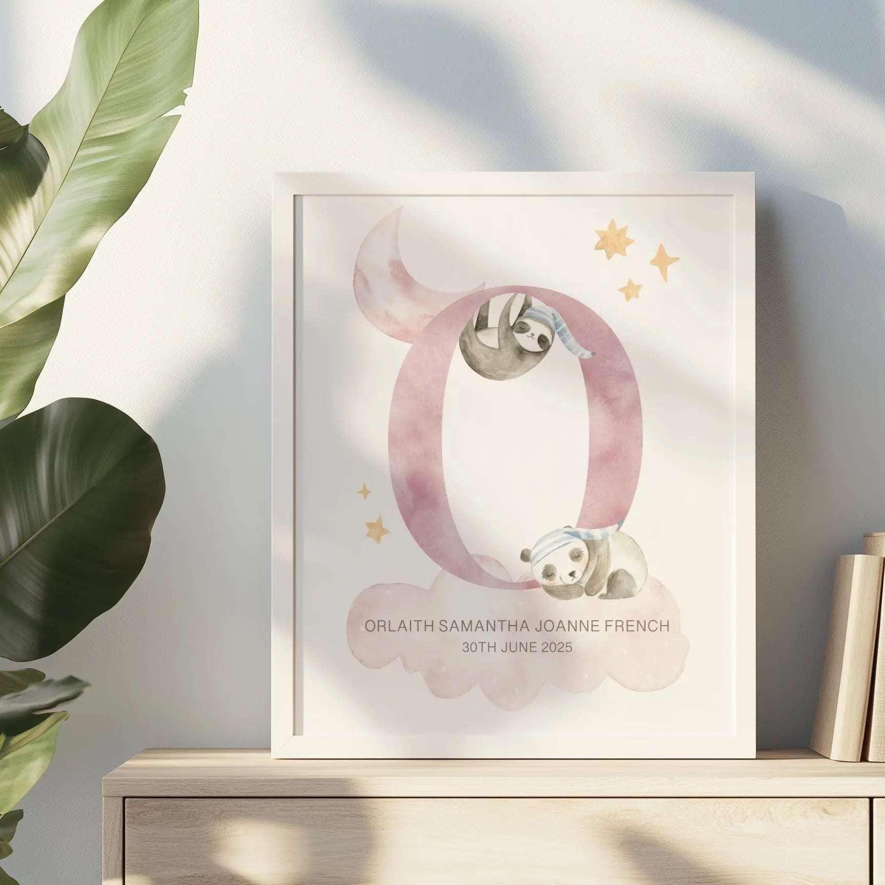 Personalised nursery print featuring two watercolour sleeping animals, soft clouds, and stars, ready for framing