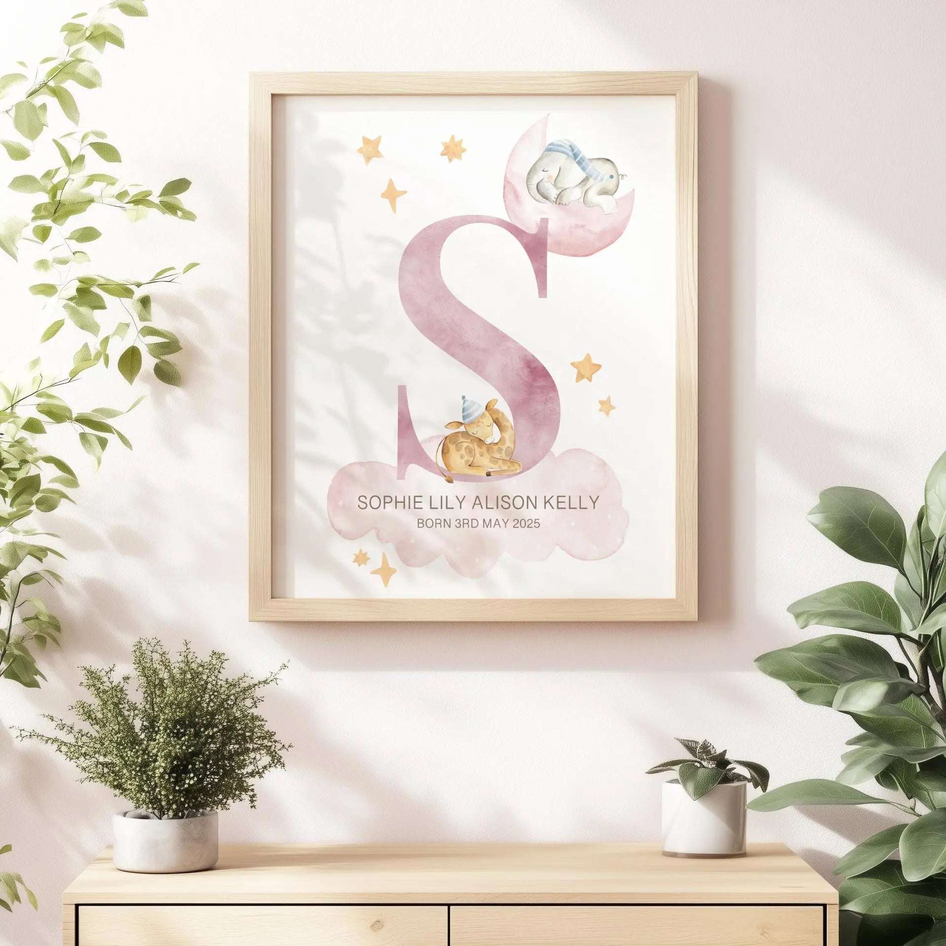 Personalised nursery print featuring two watercolour sleeping animals, soft clouds, and stars, ready for framing