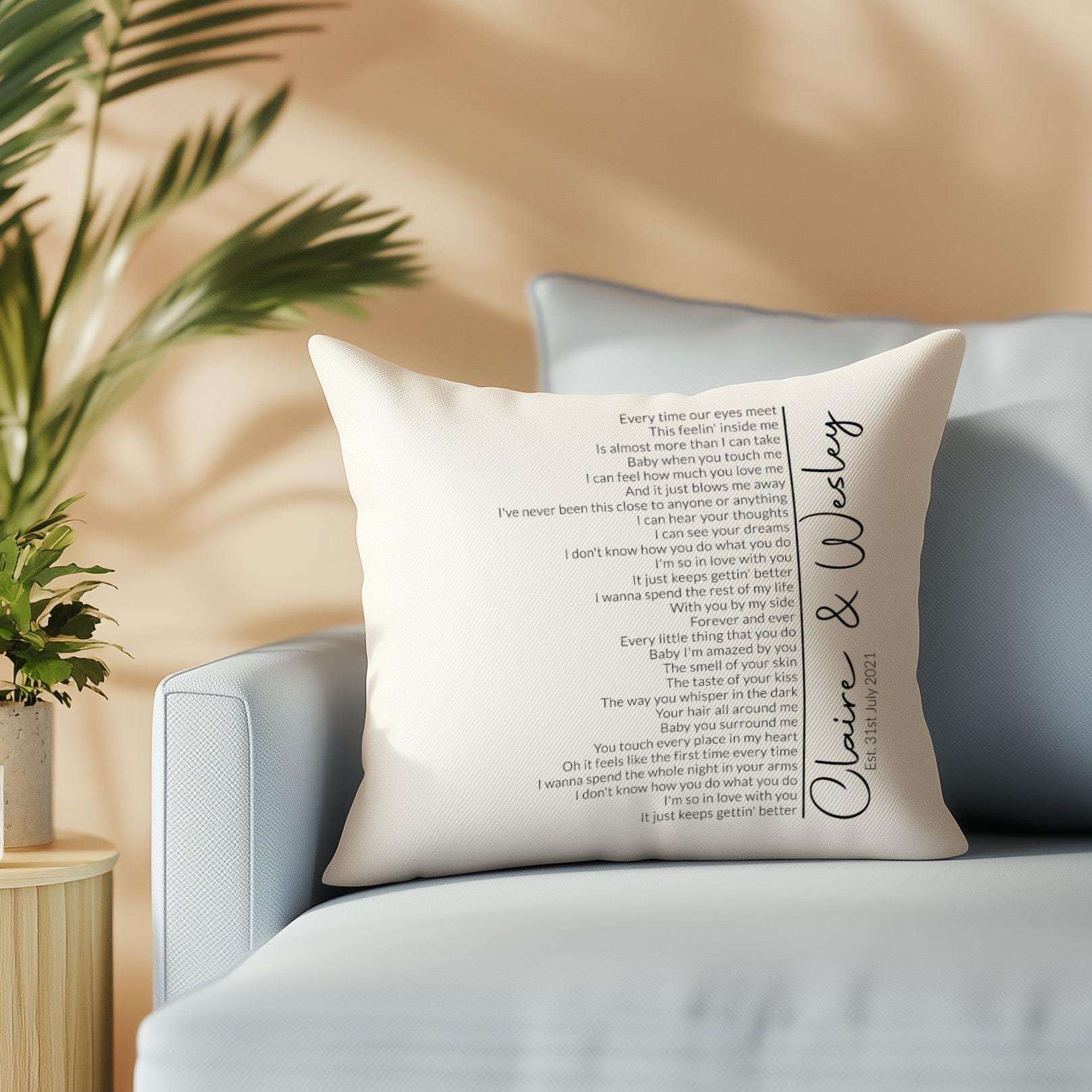 Personalised cushion featuring custom first dance song lyrics in an elegant spiral design, with couple's names and date