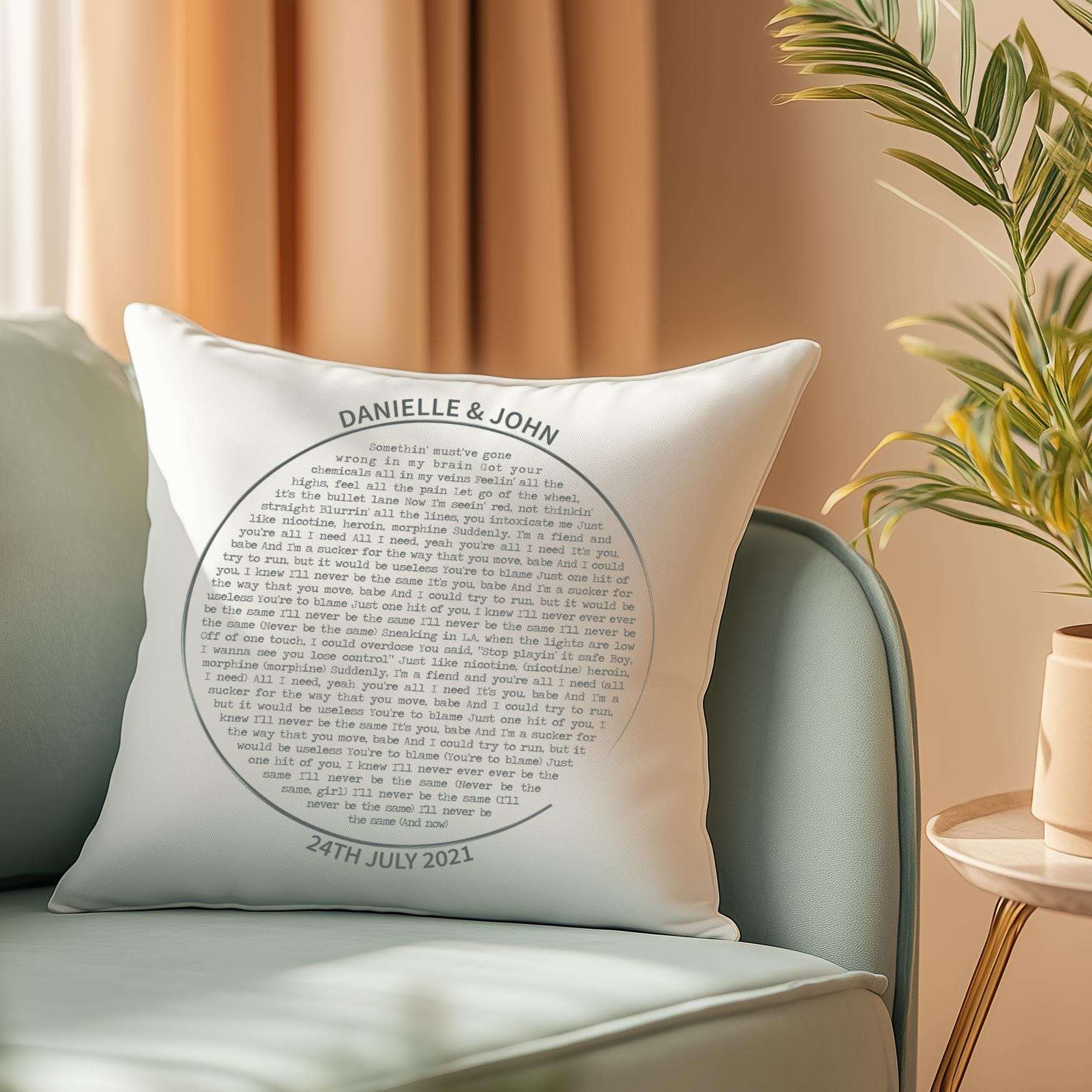 Personalised cushion featuring custom song lyrics in a spiral vinyl record design, with couple's names and date