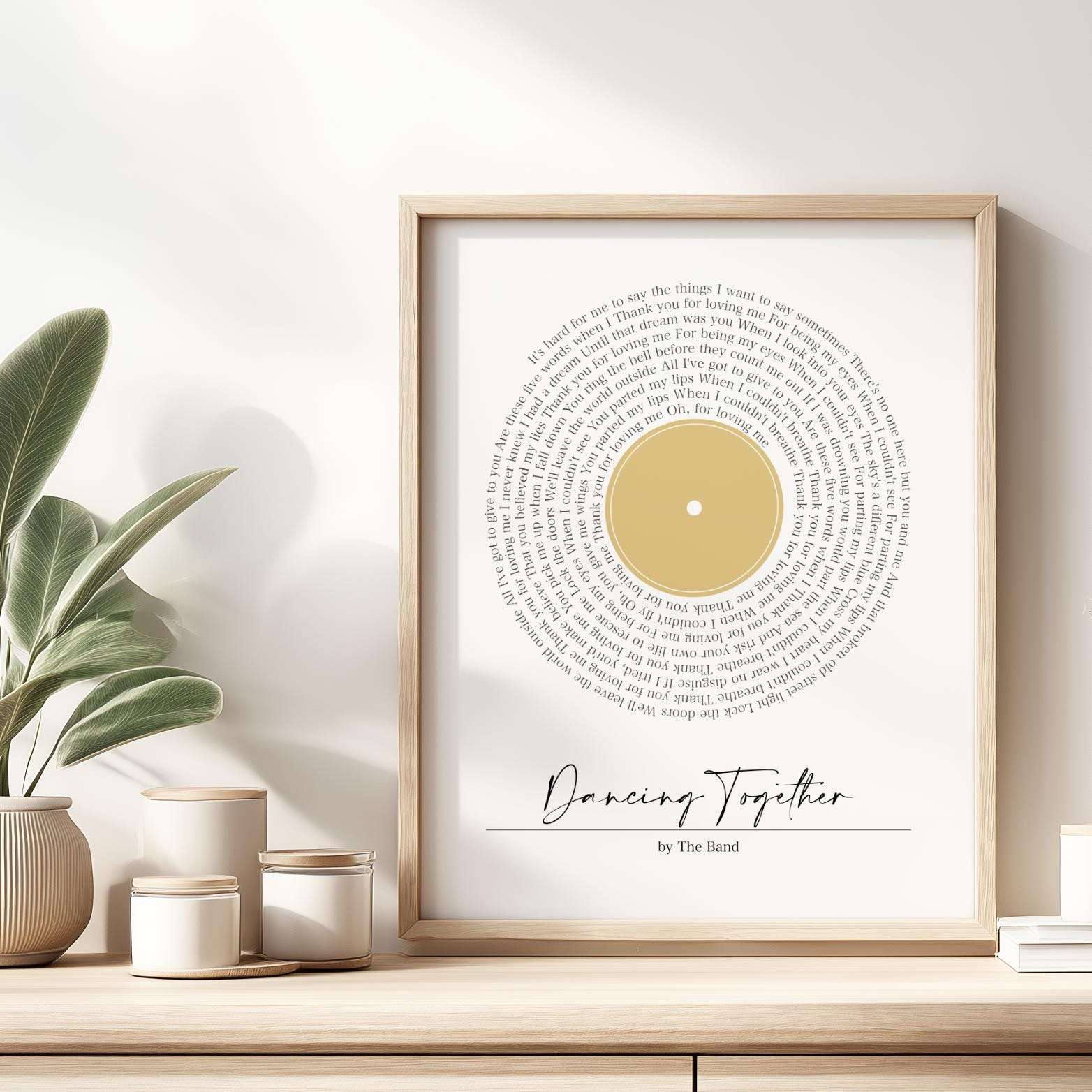 Personalised print featuring song lyrics in a classic spiral vinyl record design, custom text underneath