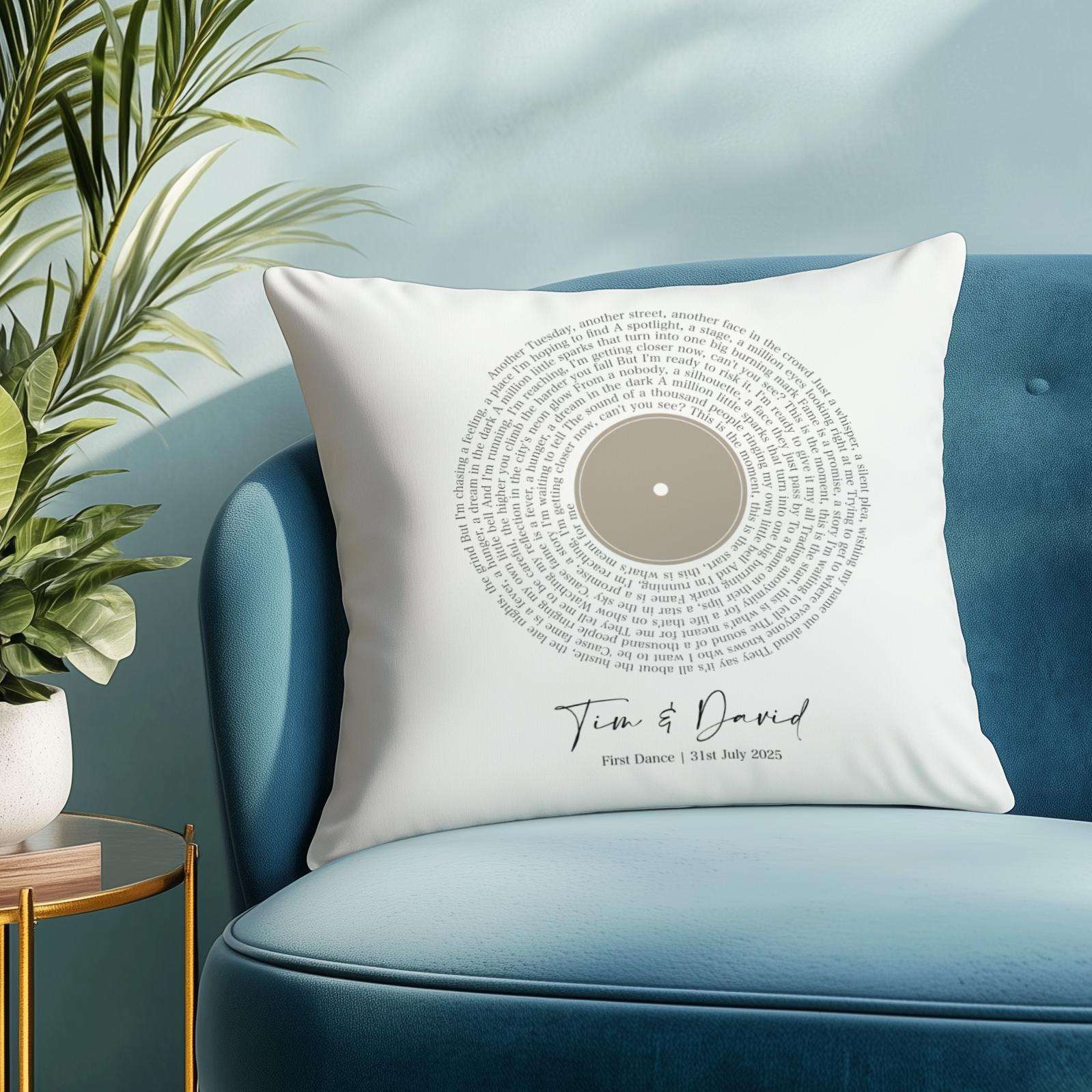 Custom cushion featuring first dance song lyrics in a spiral vinyl record design, personalised with names and date