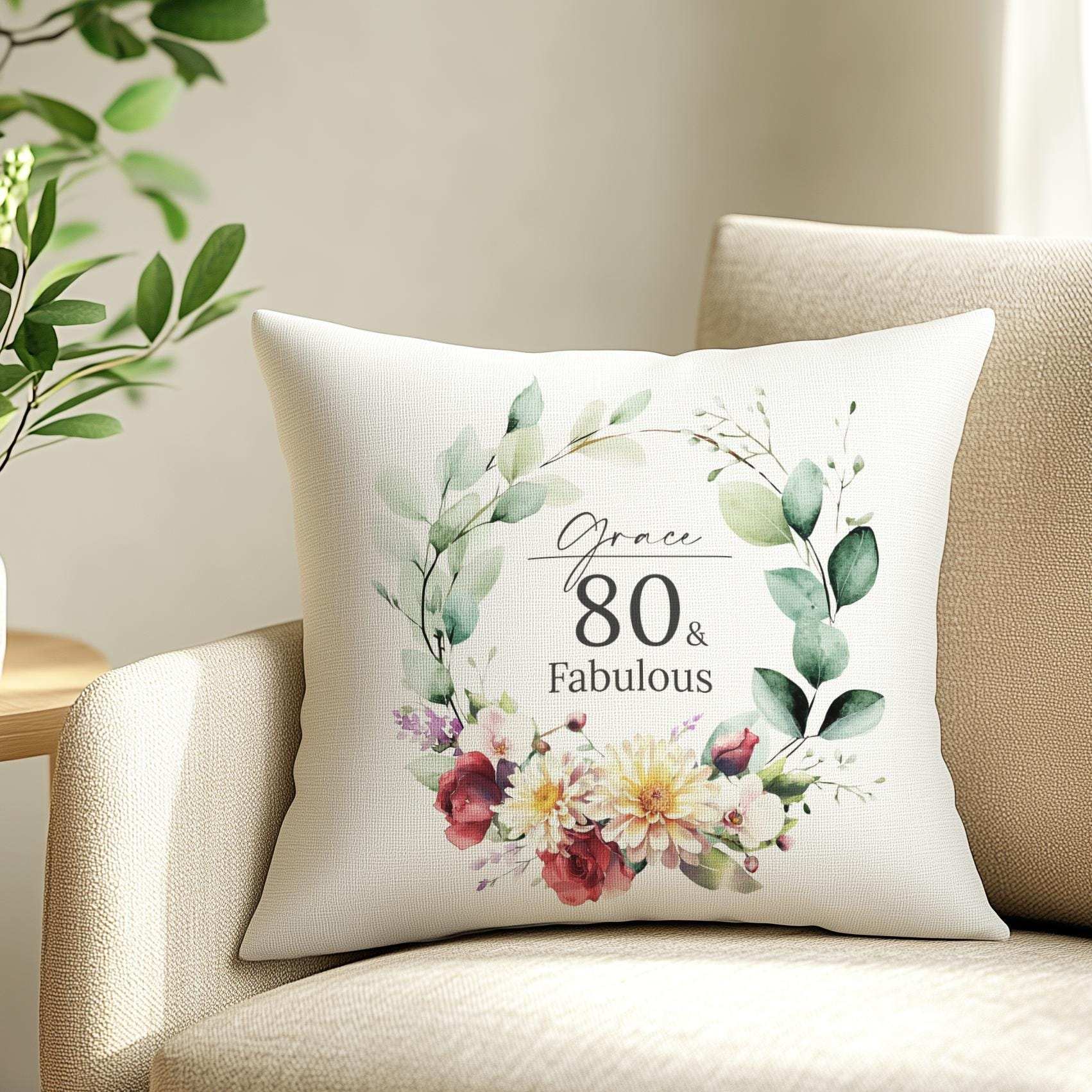Personalised 80th birthday cushion with an elegant watercolour birth month flower design, chrysanthemums, and orchids