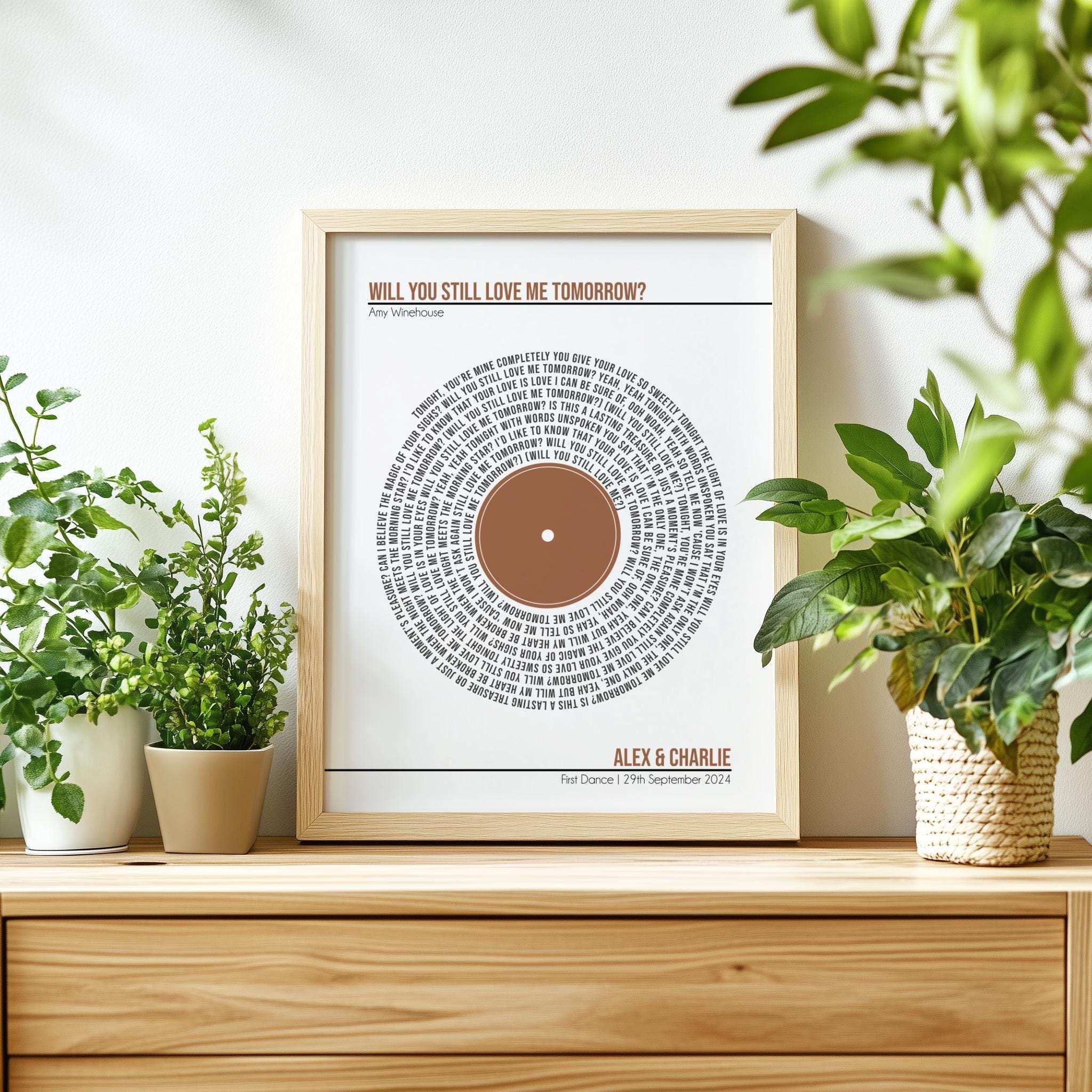 Personalised digital print featuring custom song lyrics arranged in a spiral, with a custom message and couple's names