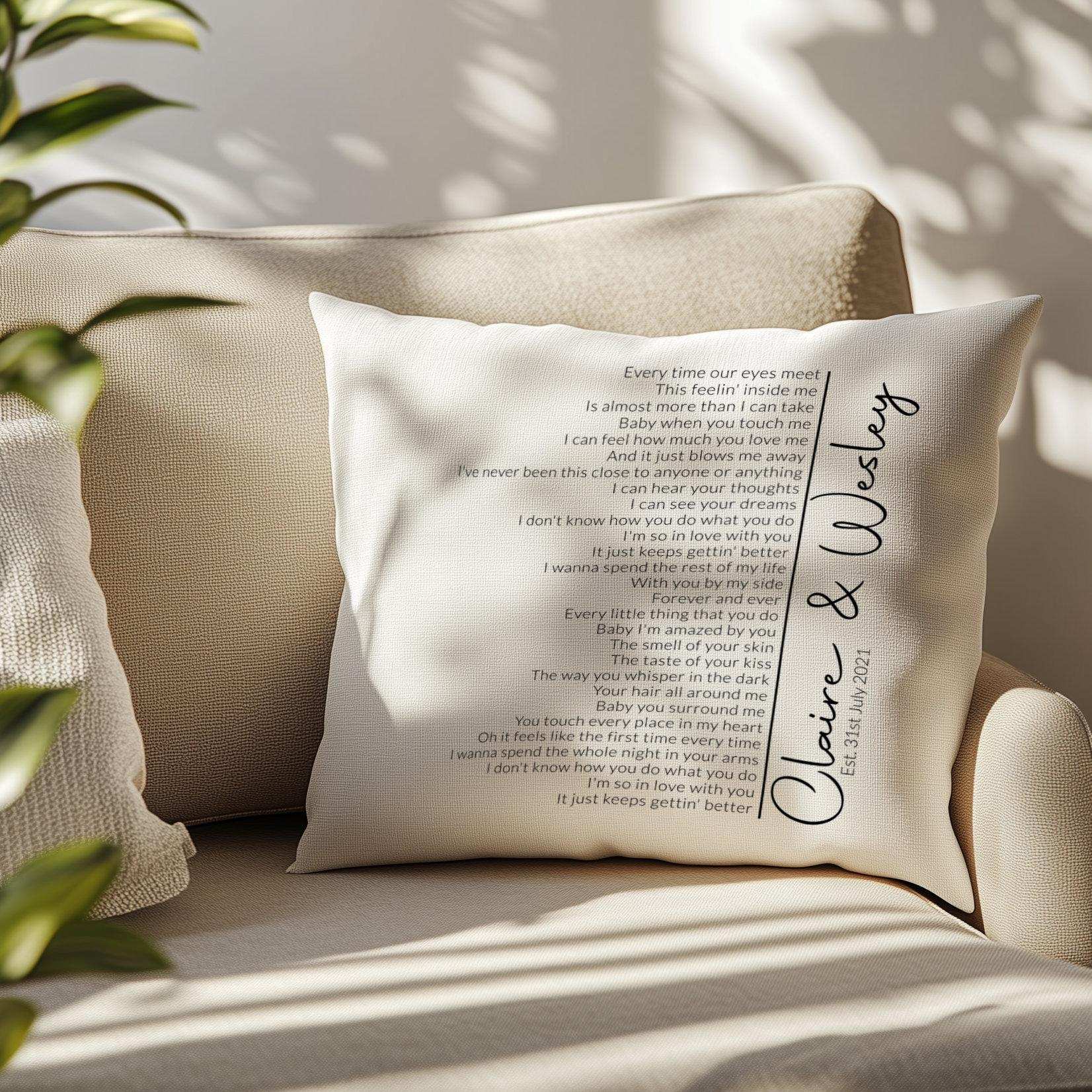 Personalised cushion featuring custom first dance song lyrics in an elegant spiral design, with couple's names and date