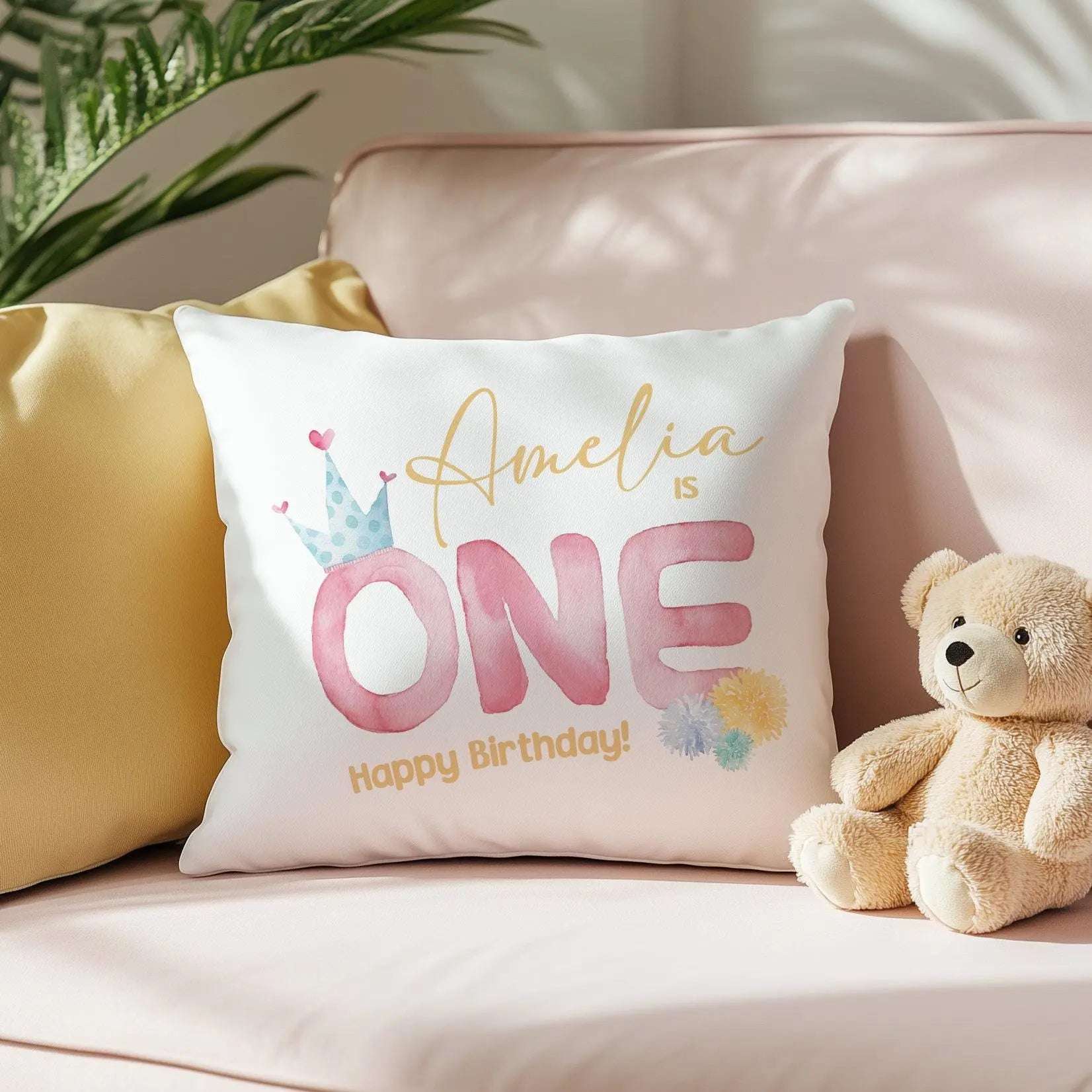 Personalised 1st birthday cushion with custom text and design, available in soft pink and gentle blue for a baby boy or girl nursery